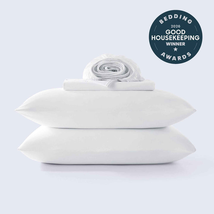 White cooling sheet set with rolled fitted and flat sheet layers