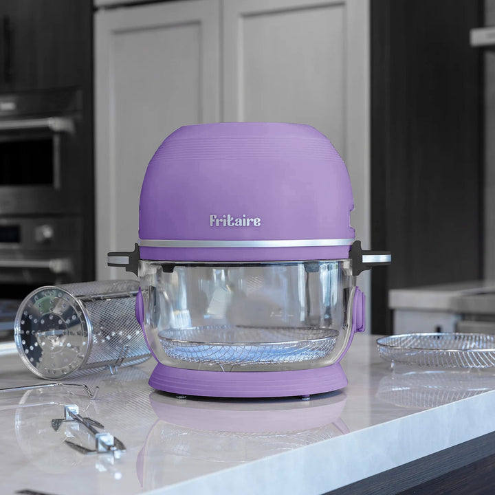 Lavender non-toxic air fryer on countertop with glass cooking bowl and rack