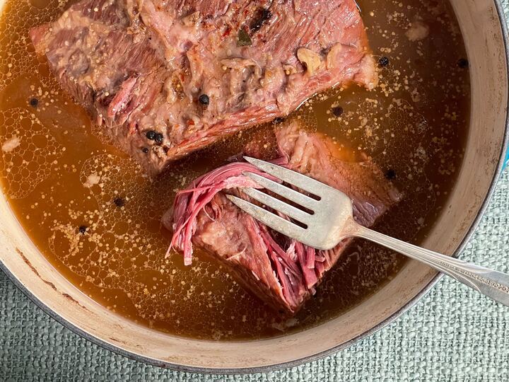 Corned beef cure kit, brined corned beef brisket in pan with fork