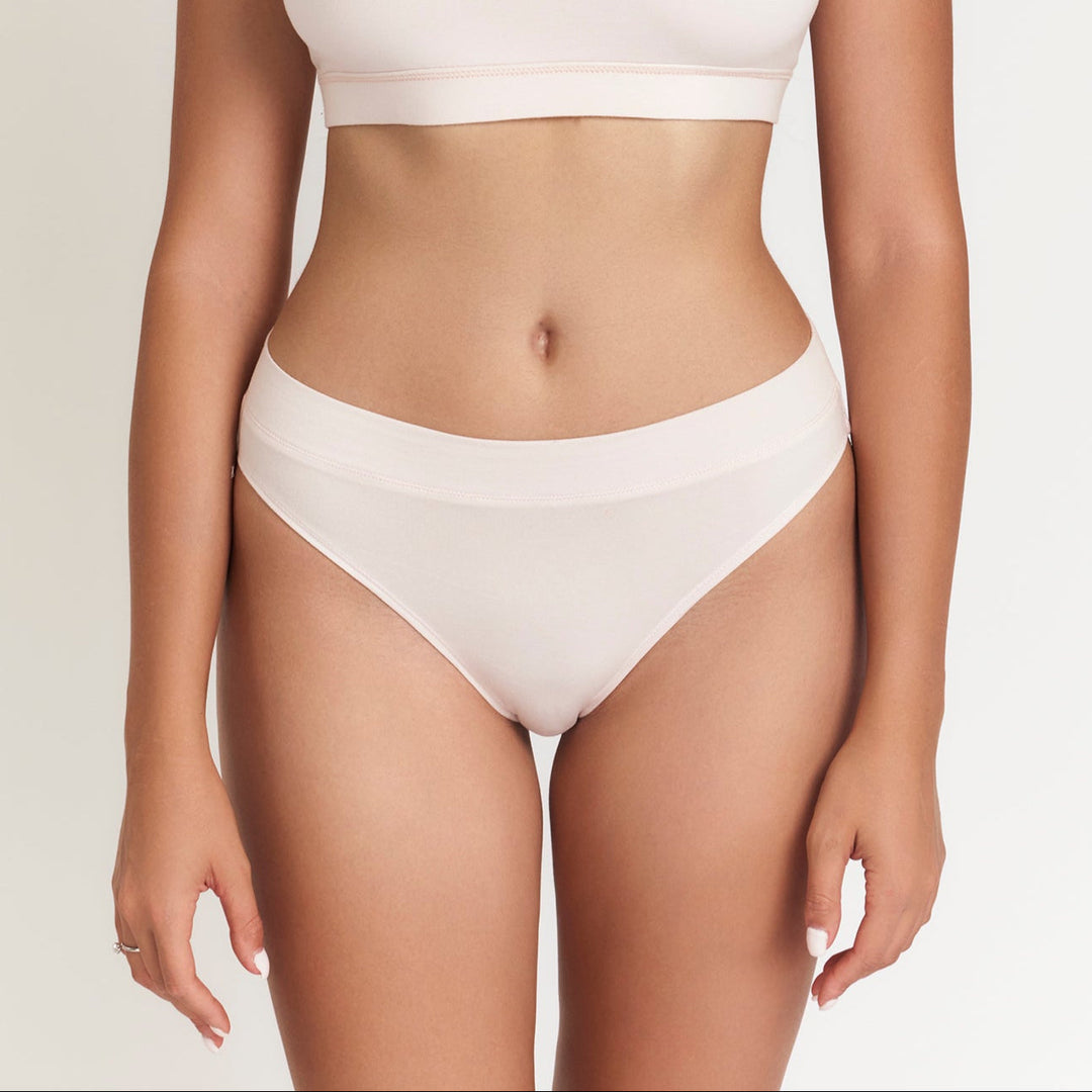 White mid-rise brief with wide elastic waistband and smooth, full-coverage leg openings.