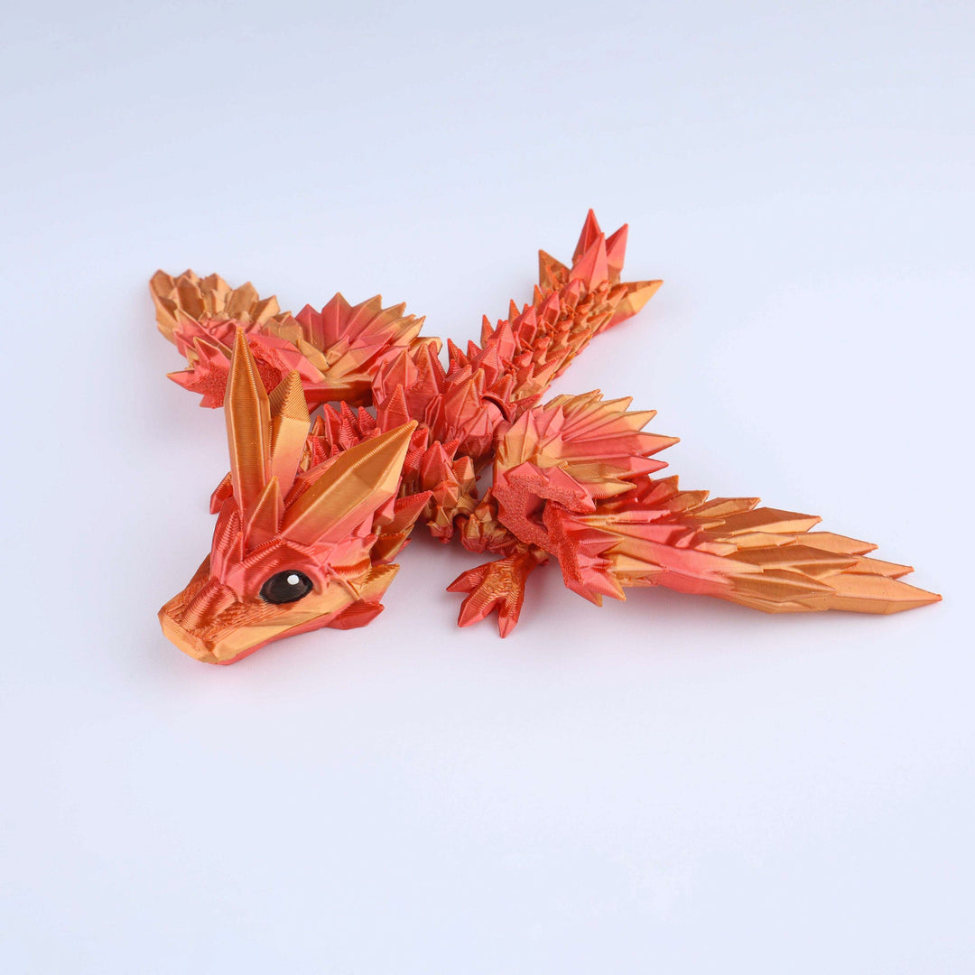 Crystal wing tadling dragon fidget toy, glossy red-orange faceted crystal body