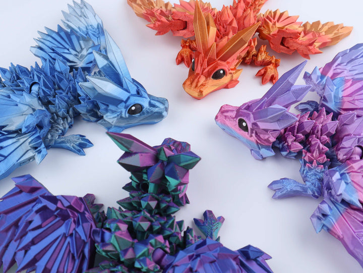 Crystal wing dragon fidget toy set, close-up of blue, purple, teal and orange dragons