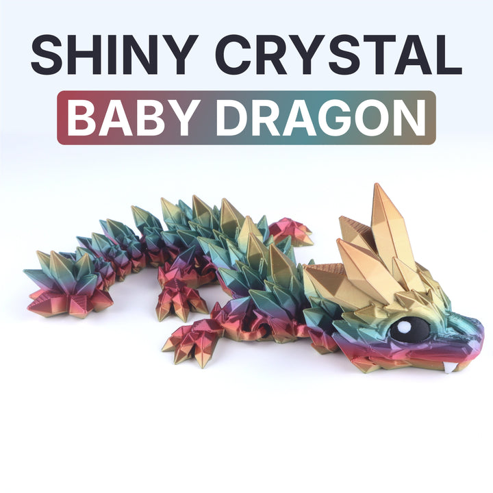 Shiny crystal baby dragon fidget toy with gold iridescent facets and white eye