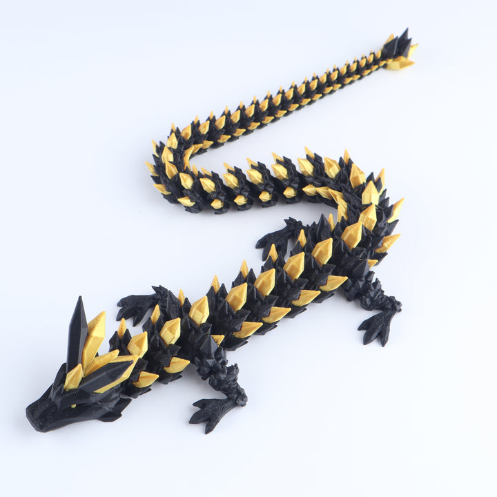 Black and gold crystal articulated dragon fidget toy with spiked tail