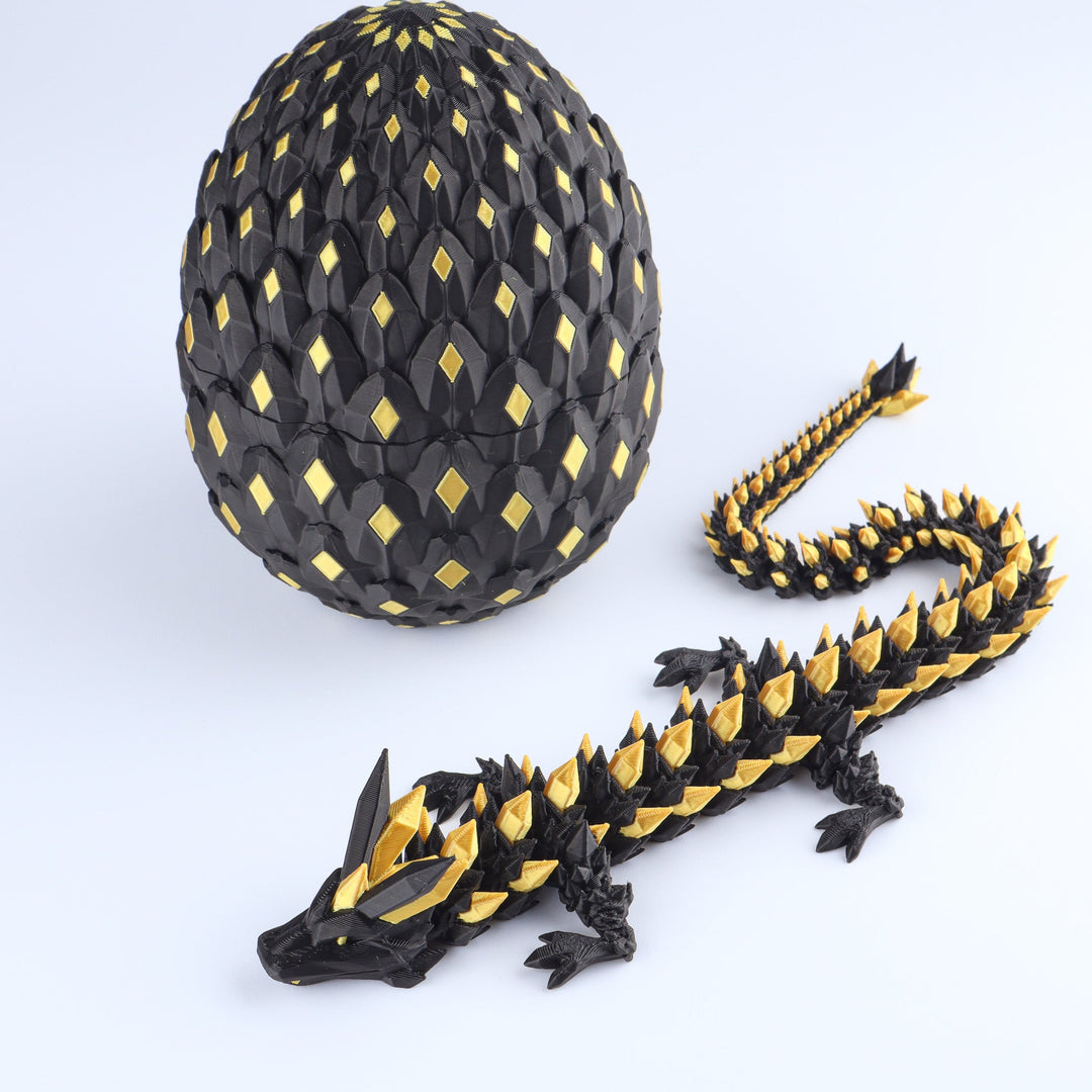 Articulated crystal dragon fidget toy with shiny black and gold egg