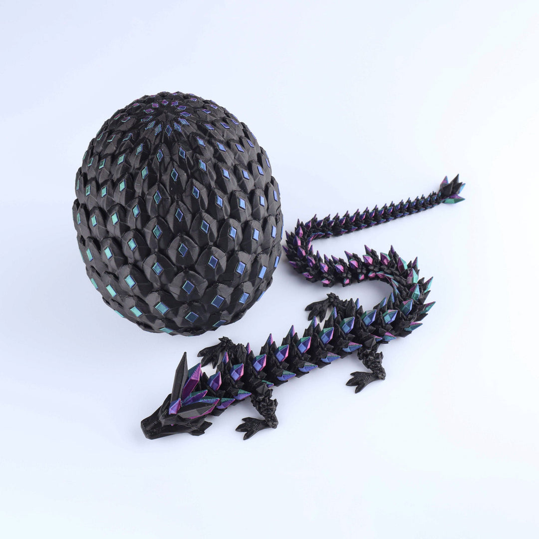 Dark crystal dragon fidget toy with faceted gray egg shell and purple articulated dragon