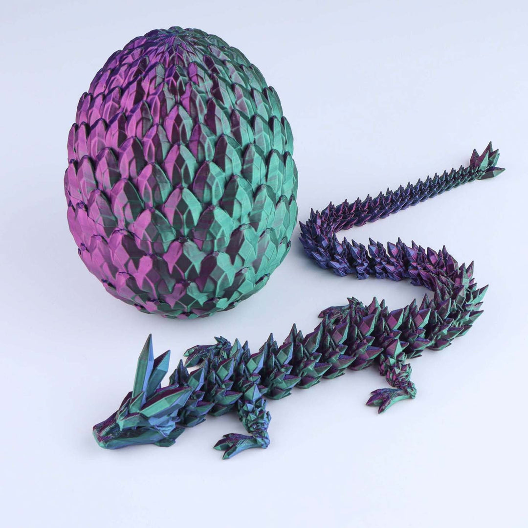 Articulated crystal dragon fidget toy with shiny purple and teal egg