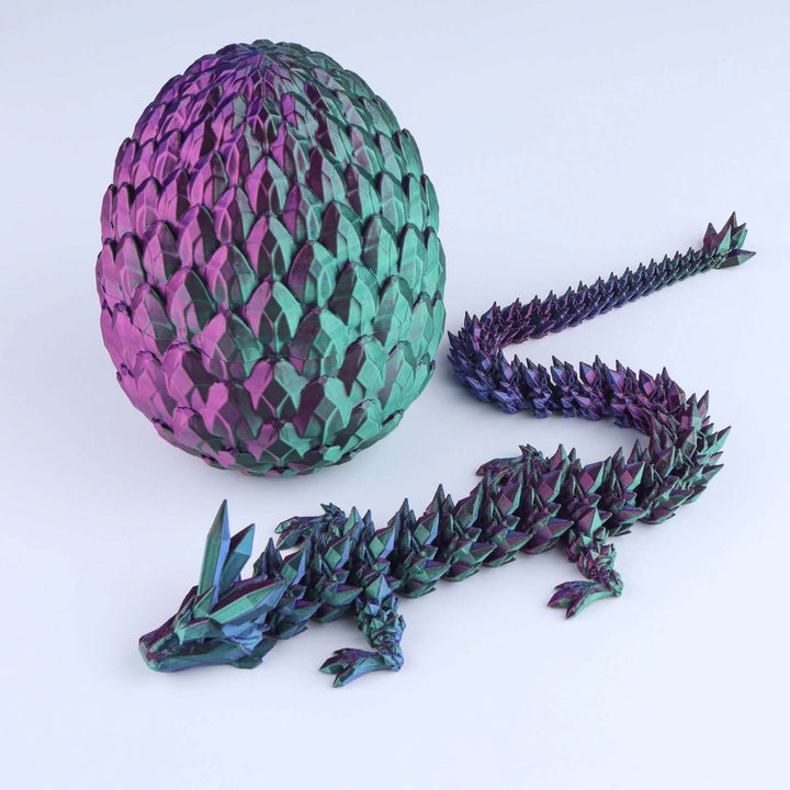 Articulated crystal dragon fidget toy with shiny purple and teal egg