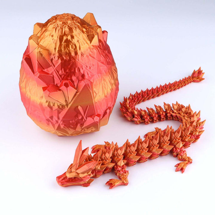 Articulated crystal dragon fidget toy with shiny orange-red egg and matching dragon
