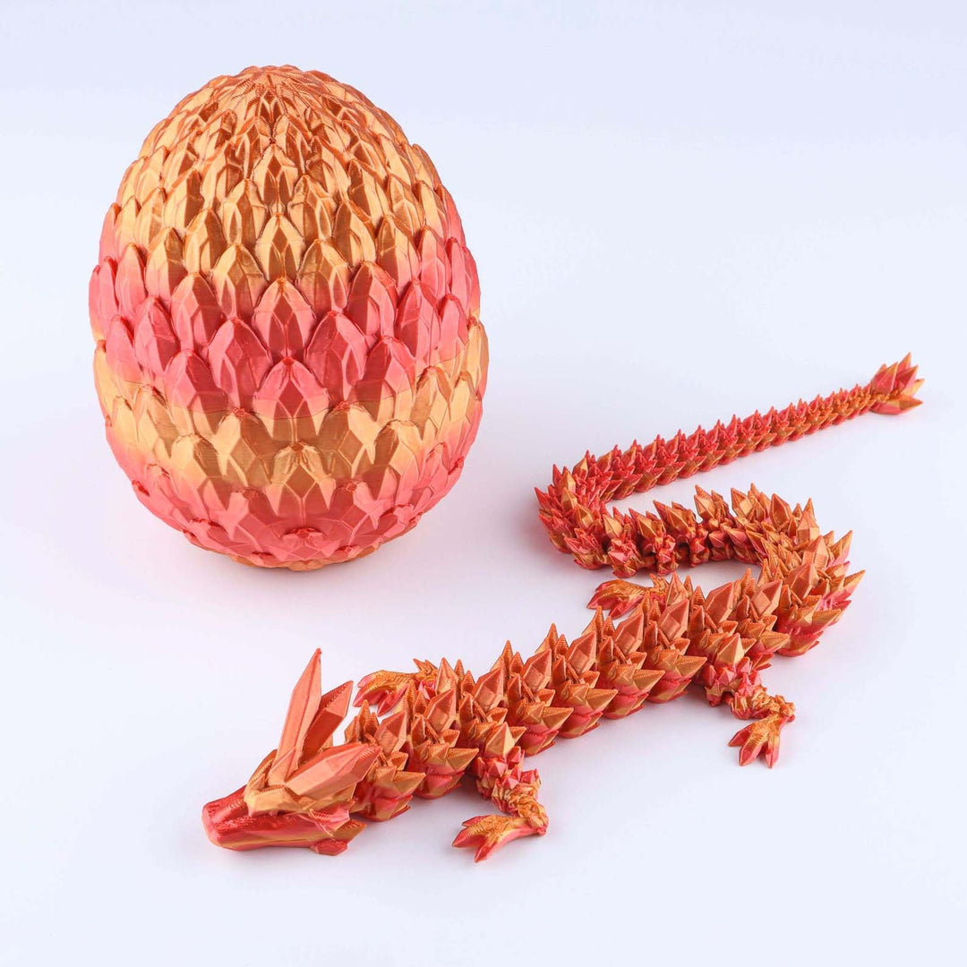 Articulated crystal dragon fidget toy with shiny orange-red egg