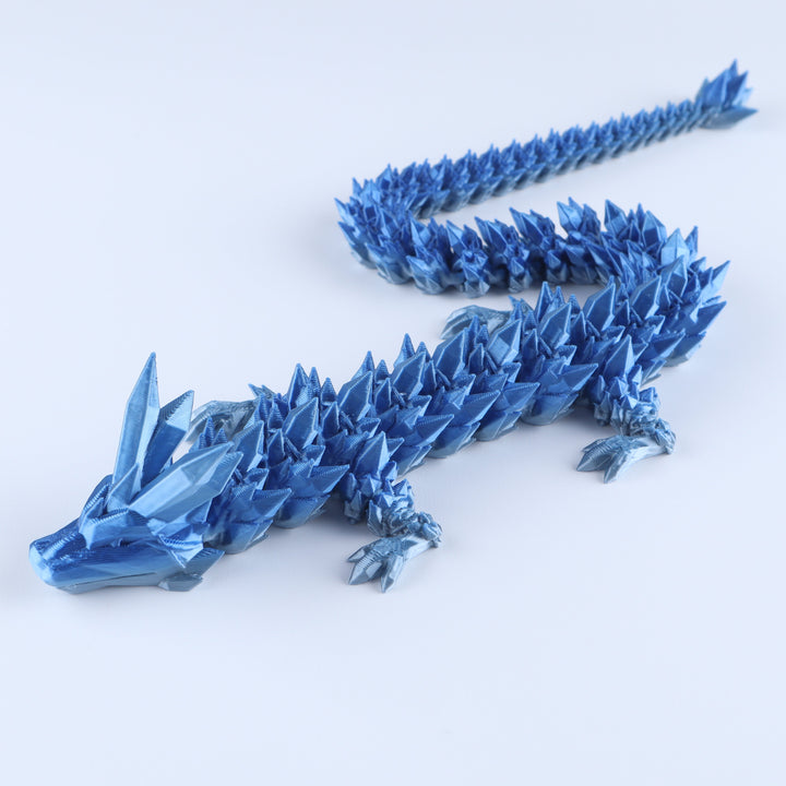 Blue crystal articulated dragon fidget toy with faceted body and spiked tail