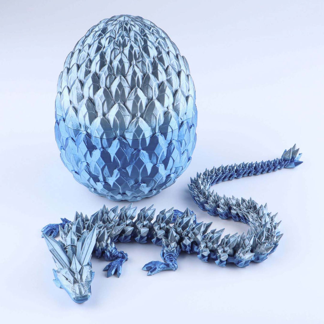 Articulated crystal dragon fidget toy with shiny light blue egg