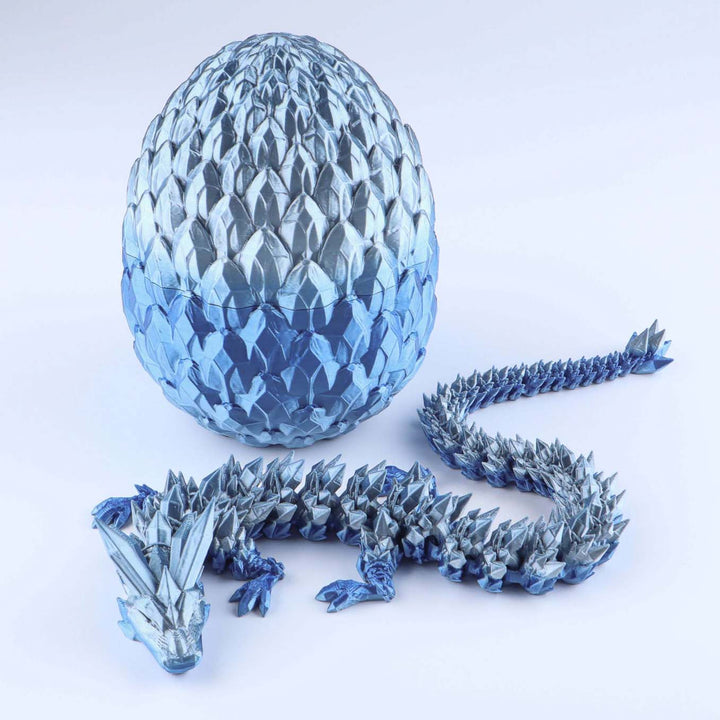 Articulated crystal dragon fidget toy with shiny light blue egg