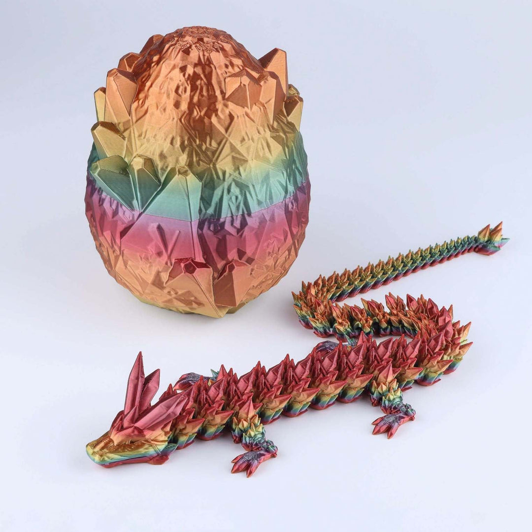 Articulated crystal dragon fidget toy with faceted gold-pink egg and rainbow dragon