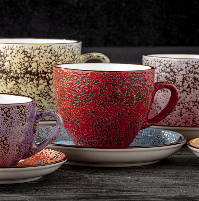 Red speckled porcelain coffee/tea cup with handle and matching saucer