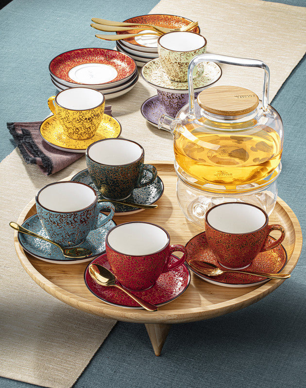 Porcelain coffee/tea cups and saucers on wooden tray, including red speckled cups