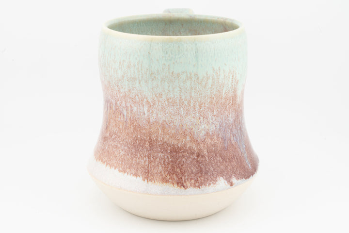 Tall ceramic mug with speckled rose-brown glaze and pale turquoise top