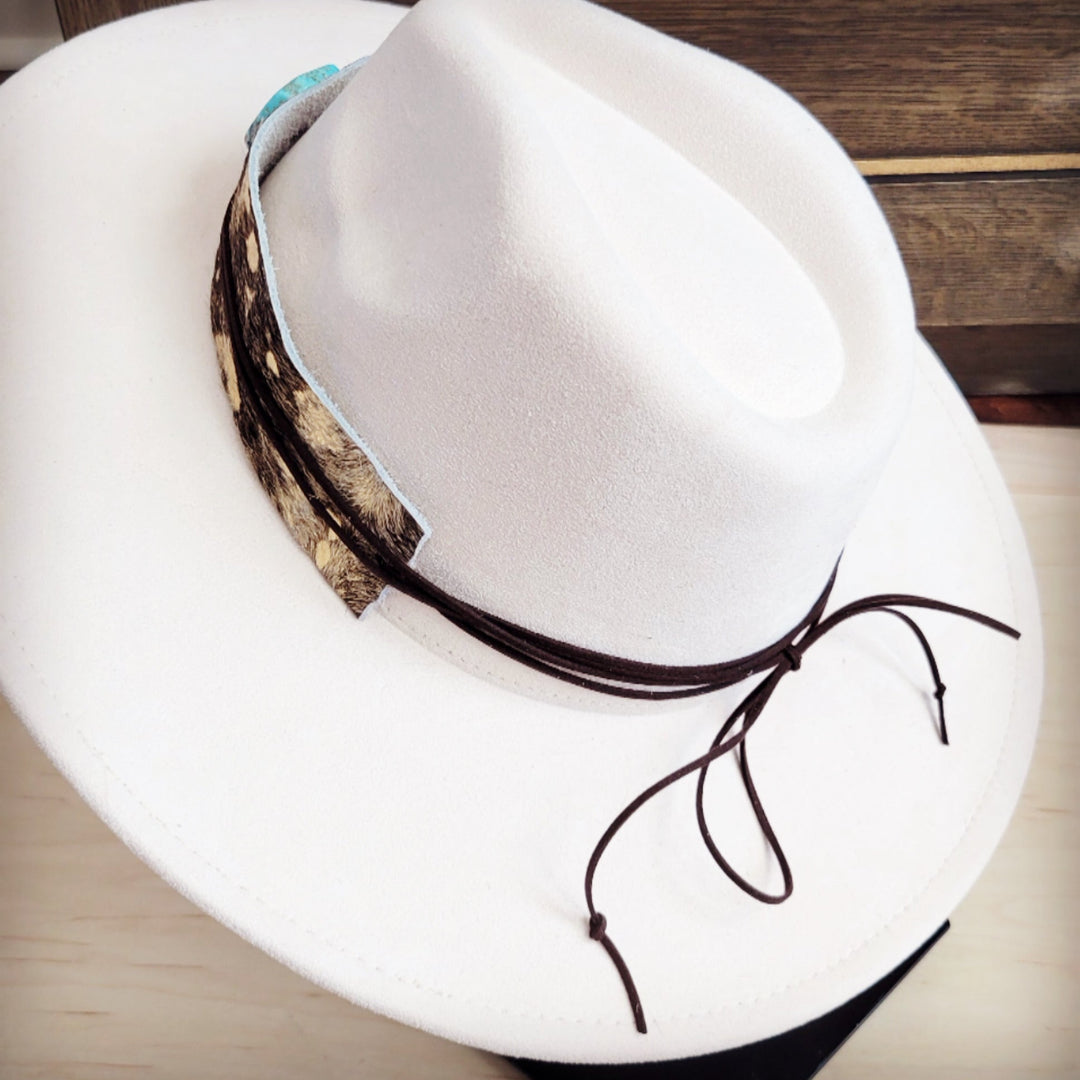 White felt hat with cowhide leather band and turquoise ornament; back view with tie