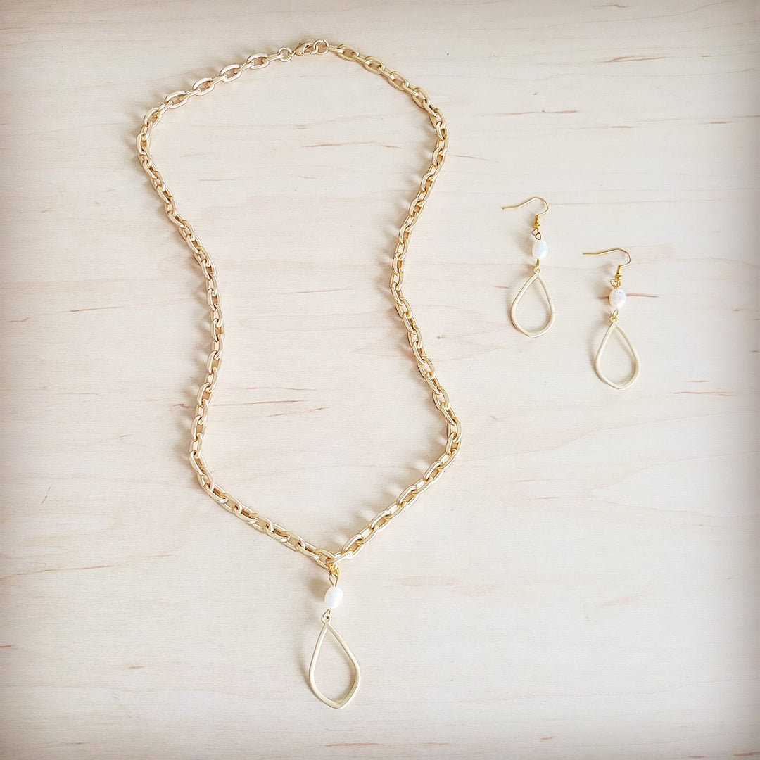 Freshwater pearl drop earrings with gold teardrop links and pearl bead