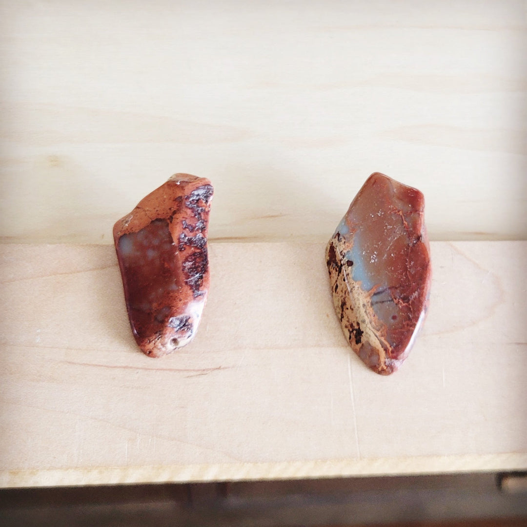 Red-brown slab stud earrings with dark veining, metal post backs