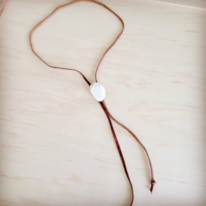 Leather lariat necklace with white oval turquoise slab pendant and long brown strands