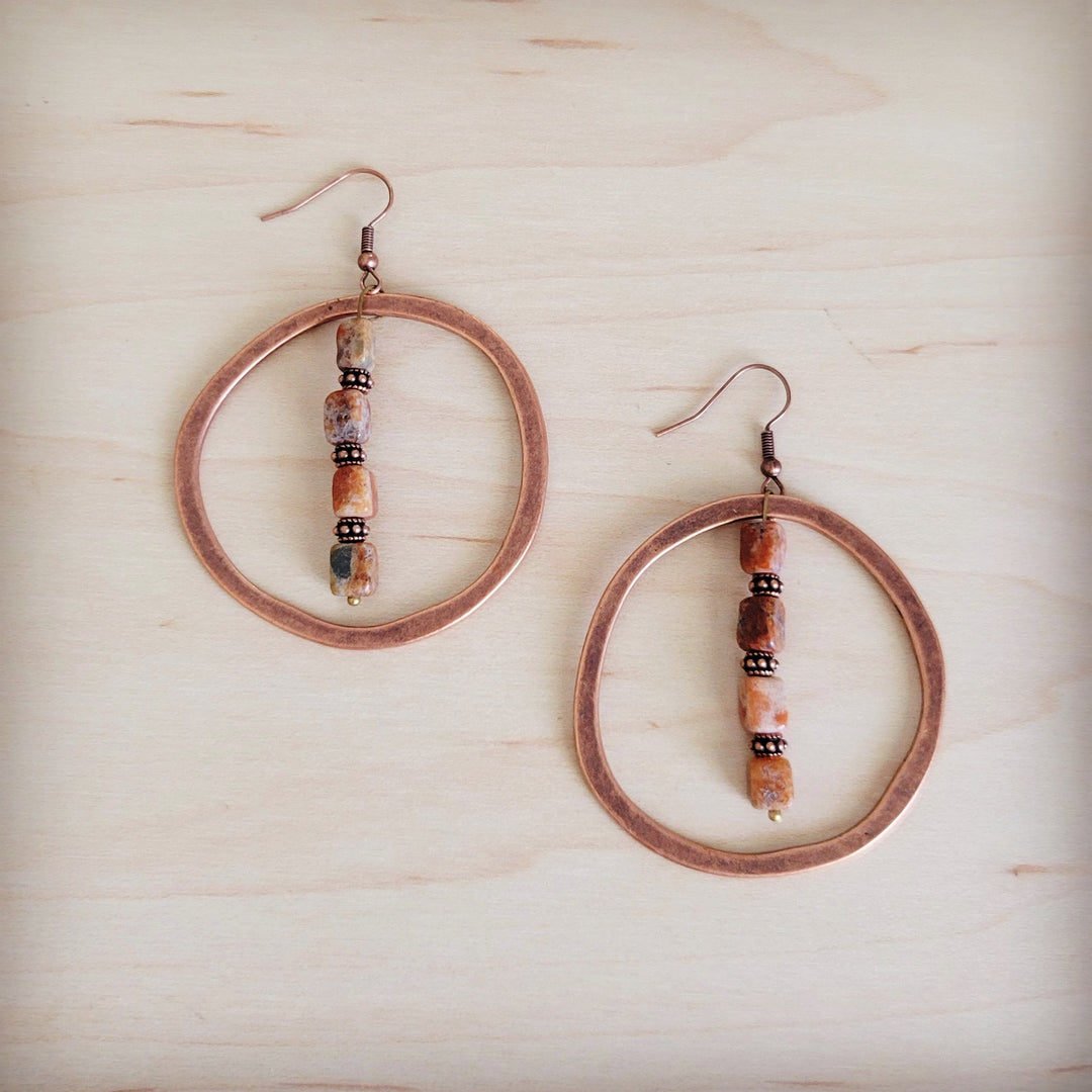 Copper hoop earrings with long bead dangles and earth-toned accents