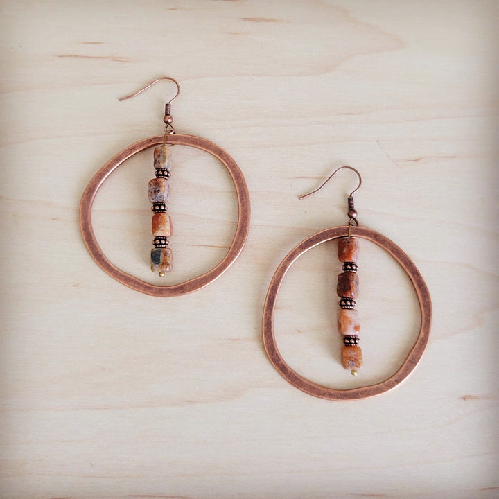 Copper hoop earrings with long bead dangles and earth-toned accents
