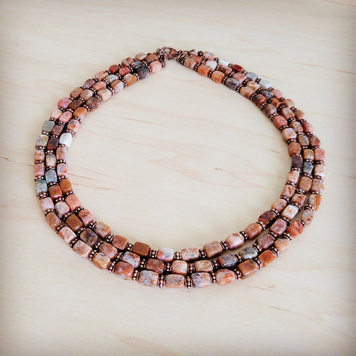 Triple-strand beaded collar necklace with copper-brown bead squares and small cube accents