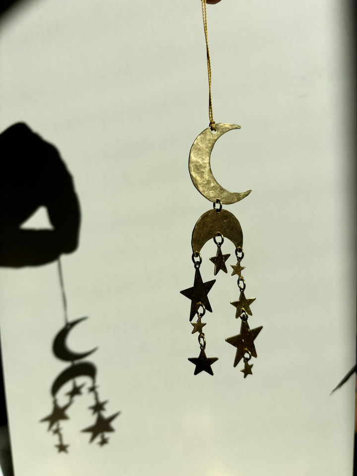 Gold crescent moon and star hanging ornament with multiple dangling charms