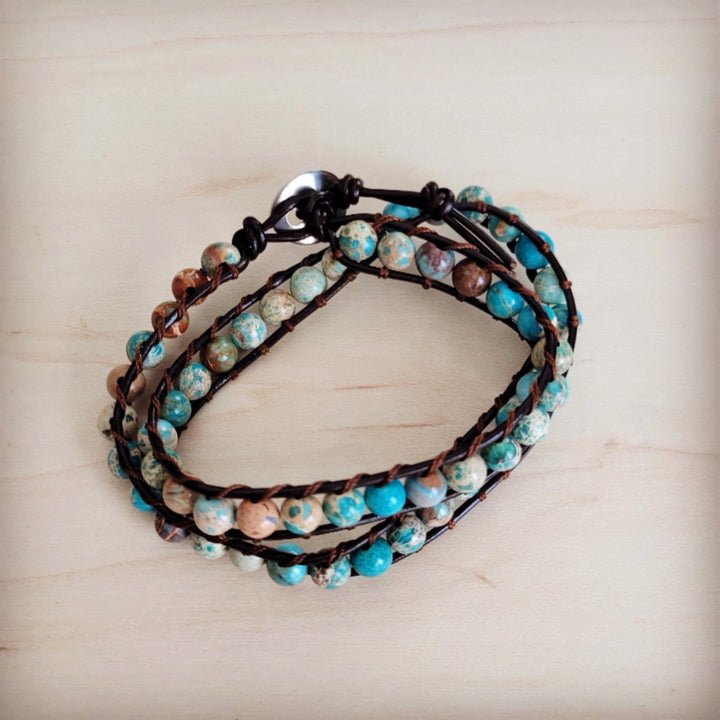 Beaded leather double-wrap bracelet featuring turquoise and pale multicolor beads