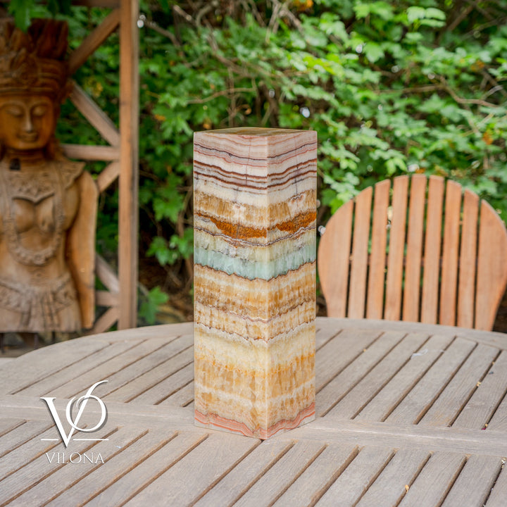 Square onyx-style table lamp with upright striped shade in cream, tan, and teal stripes