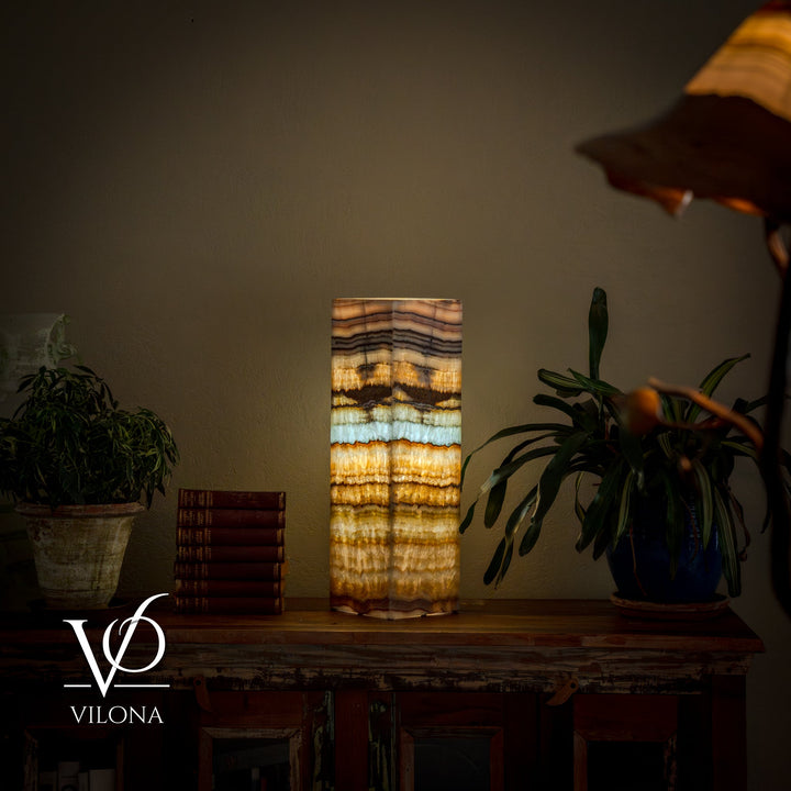 Square table lamp with striped onyx-style shade in gold, cream, and blue-green hues