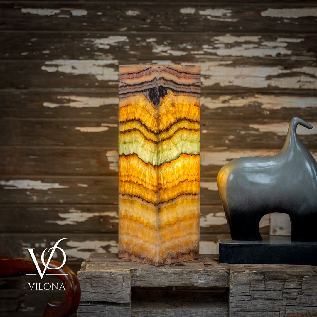 Square onyx table lamp with layered zigzag stripes in amber, cream, and pale aqua