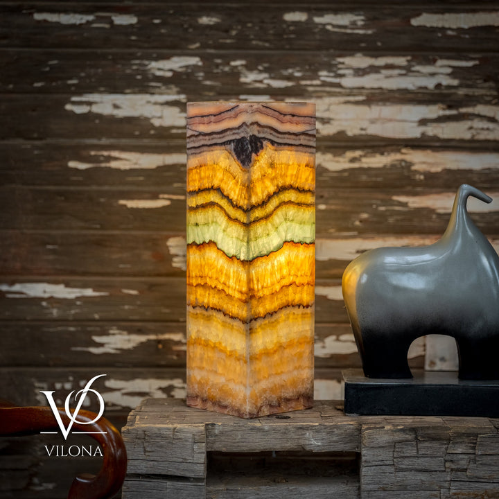 Square onyx table lamp with layered zigzag stripes in amber, cream, and pale aqua