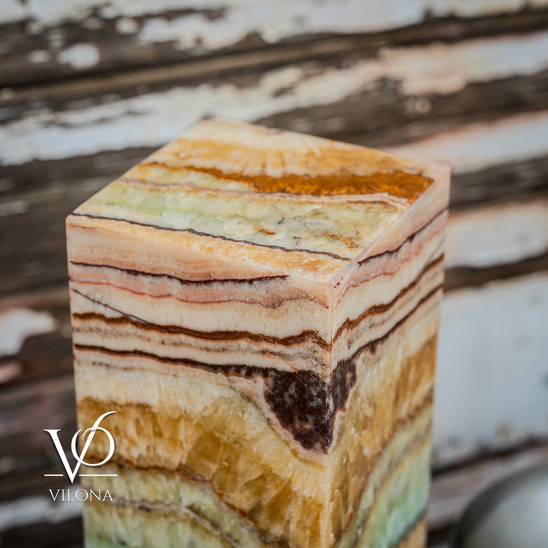 Close-up of square onyx table lamp top and side, with layered amber, cream, and green