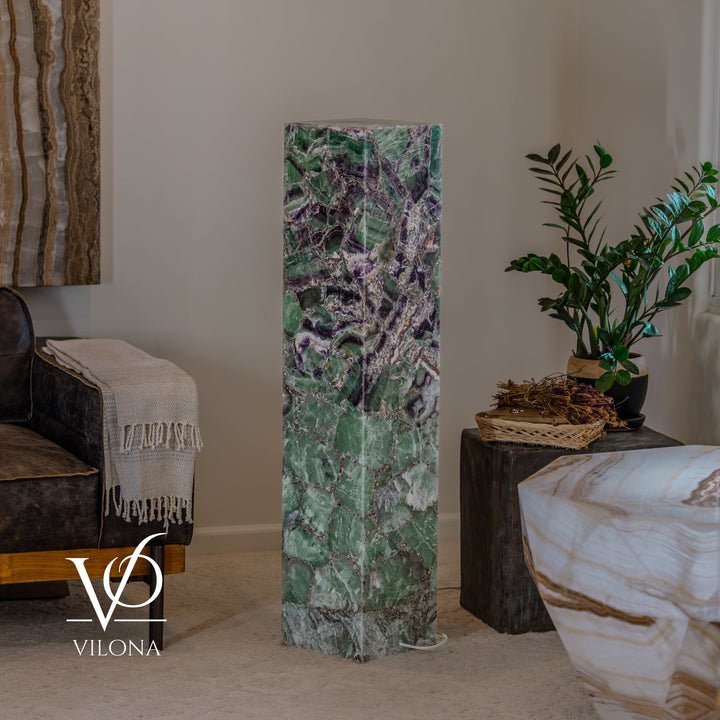Fluorite floor lamp column with mottled green and purple mineral texture, glowing