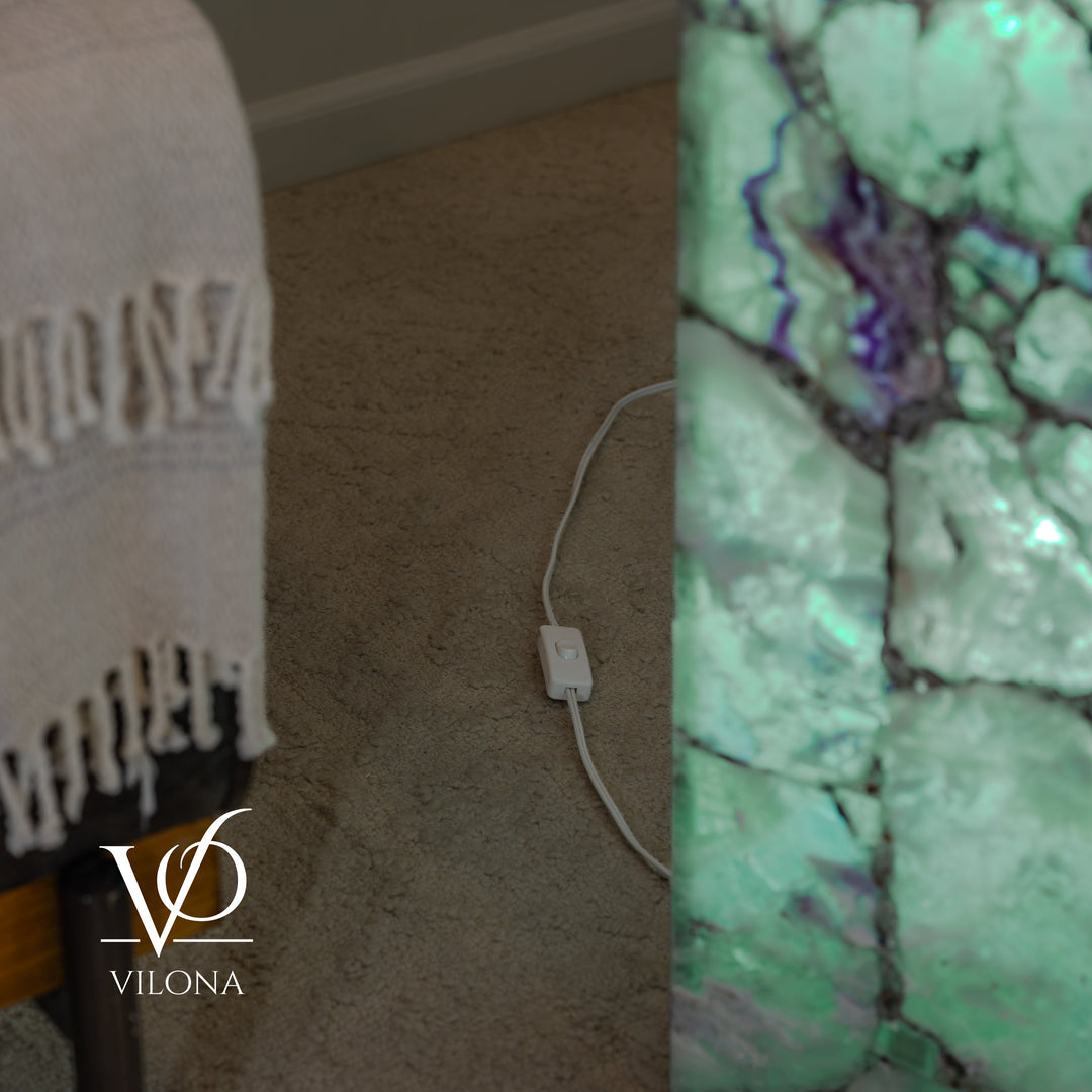 Fluorite floor lamp showing glowing side and power cord by the base