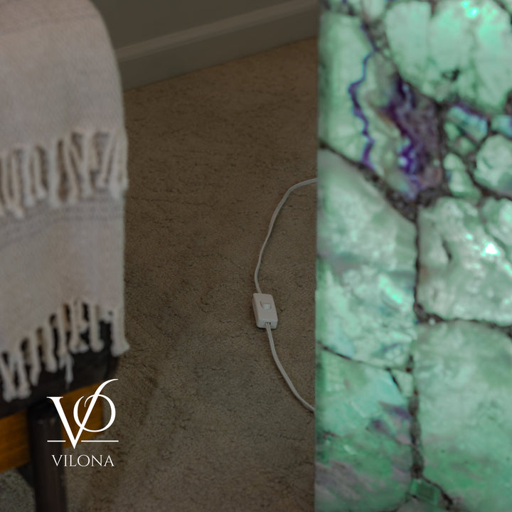 Fluorite floor lamp showing glowing side and power cord by the base