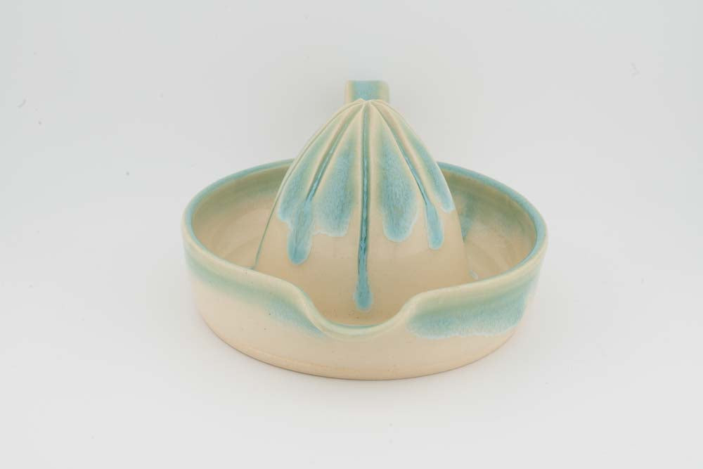 Ceramic citrus juicer bowl with teal glazed cone top and side handle