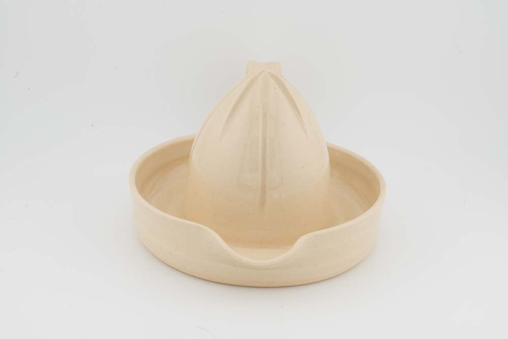 Ceramic citrus juicer with cream cone squeezer and rounded bowl edge