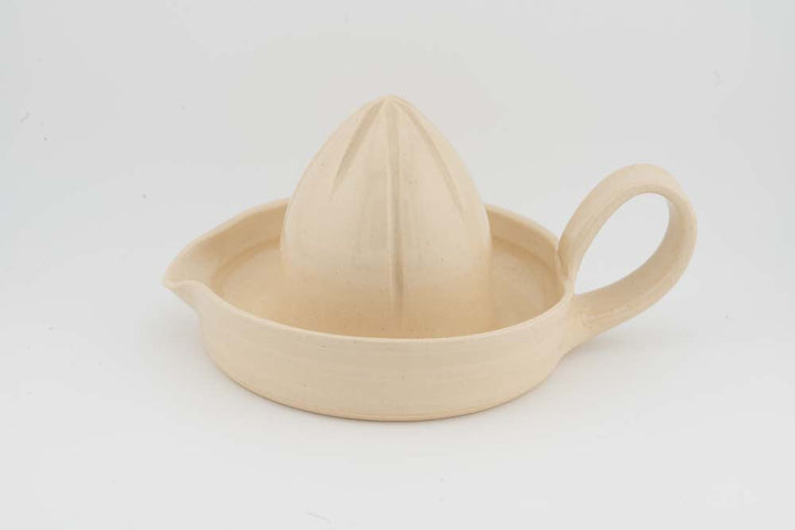 Ceramic citrus juicer with cream glaze cone squeezer and side handle
