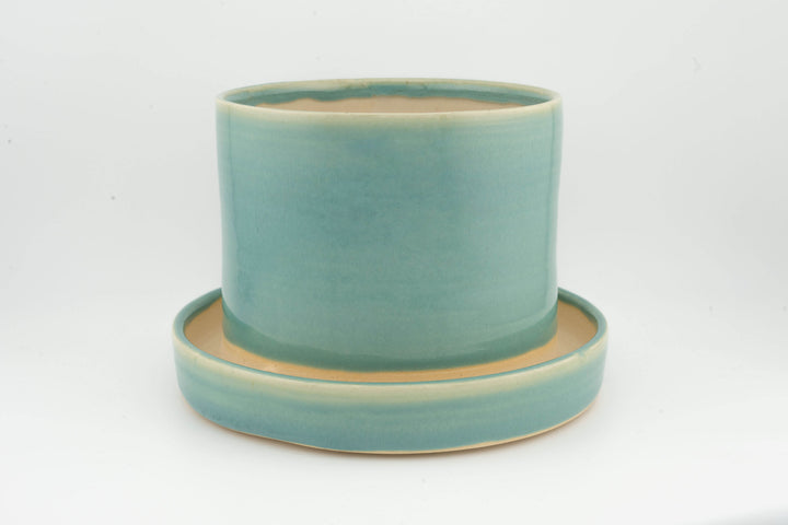 Tabletop planter set with drainage, teal glazed pot on matching tray with thin rim.