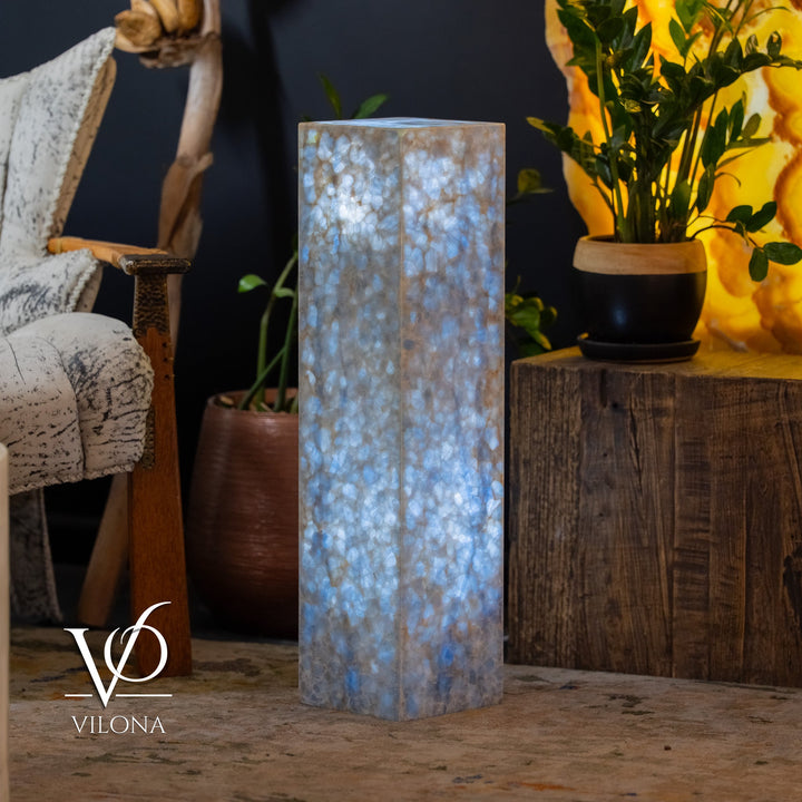 Blue square column floor lamp with glowing translucent textured sides.