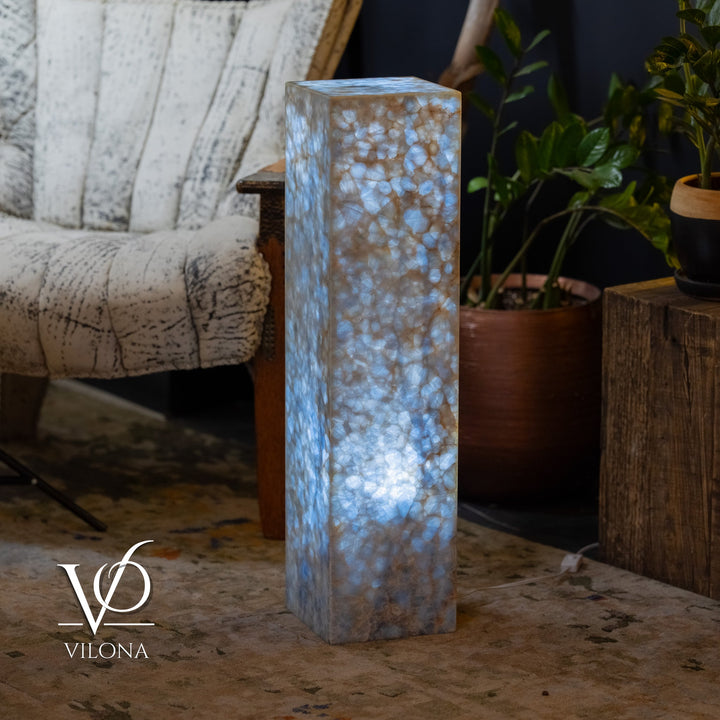 Blue square column floor lamp, close front view, translucent textured glow.