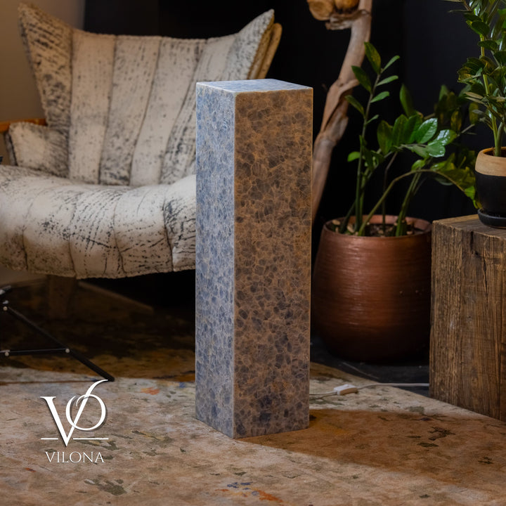 Blue square column floor lamp, front view, textured stone-like surface.