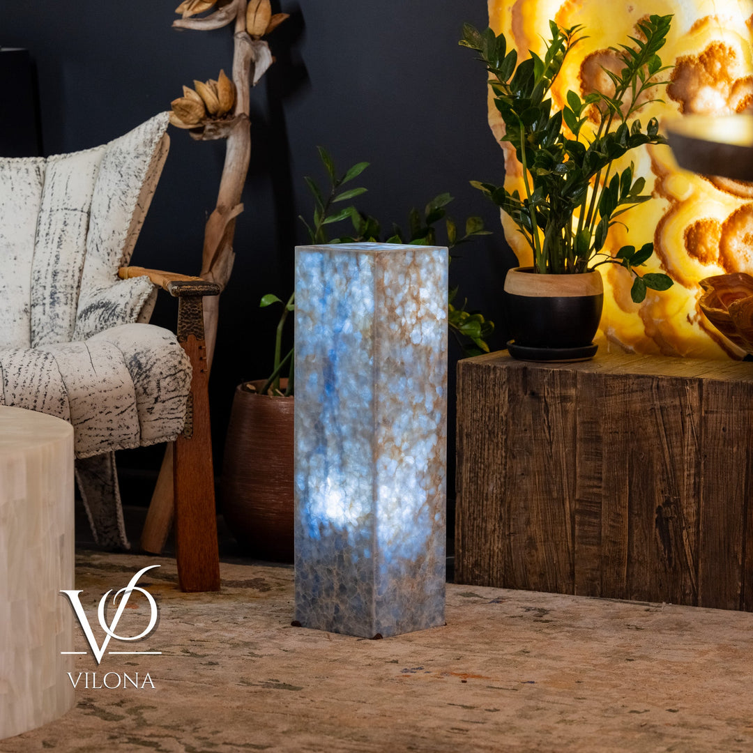 Small square blue stone floor lamp with vertical glow and textured blue-gray body