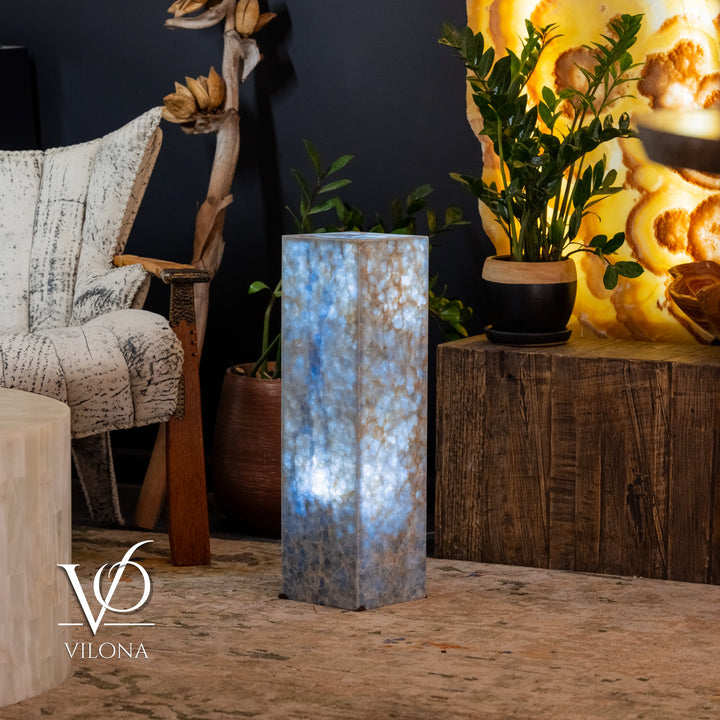 Small square blue stone floor lamp with vertical glow and textured blue-gray body