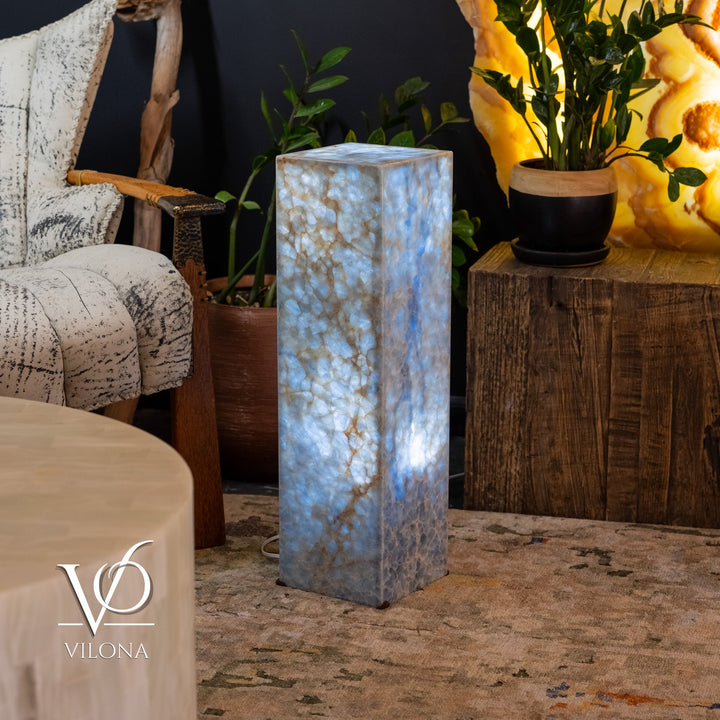 Small square blue stone floor lamp, full front view with illuminated core