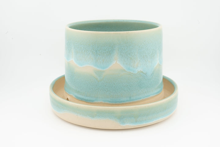 Tabletop planter set with drainage, light teal glazed pot with wavy drip effect on tray.