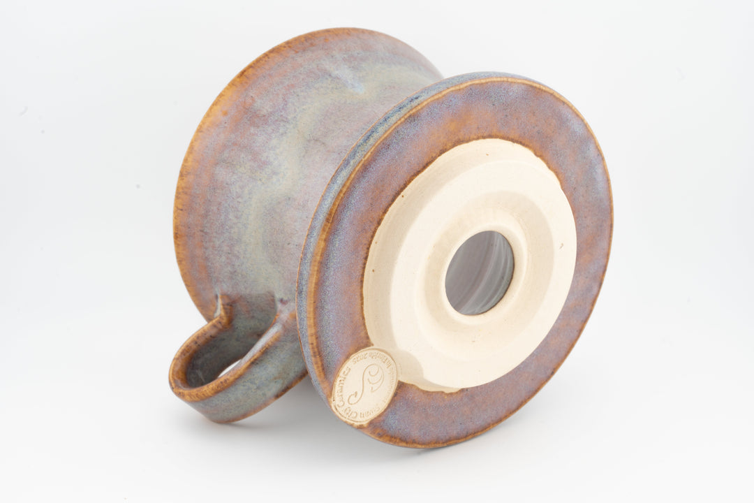 Ceramic coffee pour-over dripper base, warm gray speckled glaze with centered outlet